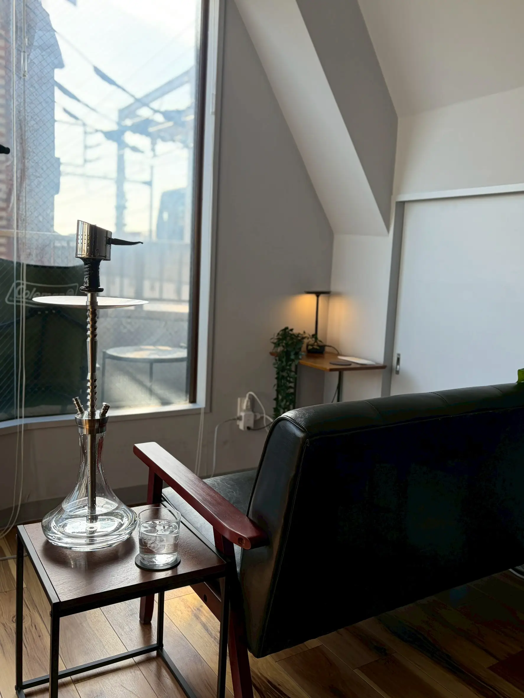 shisha bar IORI by day: natural light over a window-side sofa seat and a hookah